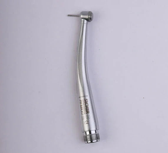 Silver high speed dental airotor handpiece with bur on a plain background