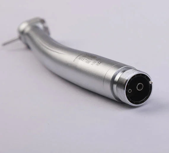 Close-up of a silver dental airotor handpiece on white background