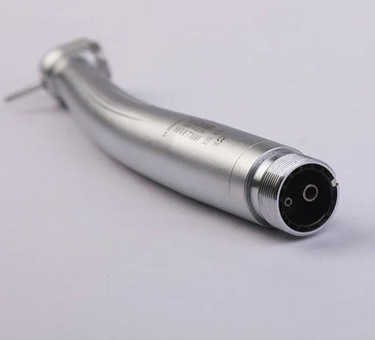 Close-up of a silver dental airotor handpiece on white background