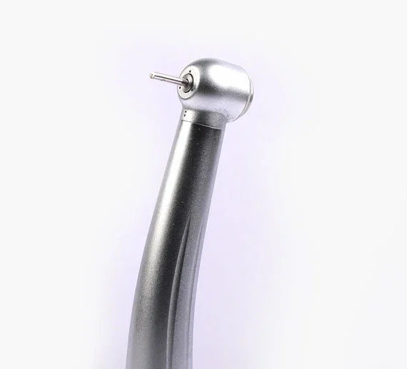 Close-up of a silver dental airotor handpiece on a white background
