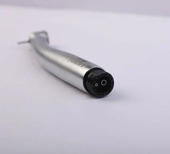 Close-up dental airotor handpiece on white background, dental equipment
