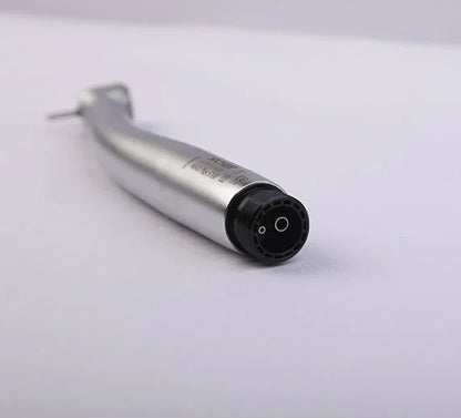Close-up dental airotor handpiece on white background, dental equipment